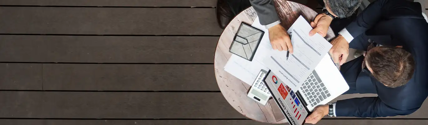 Two tax professionals calculating tax